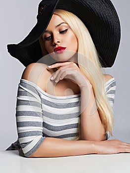 Beautiful young woman in hat. summer fashion beauty blond girl