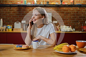 Beautiful young woman having breakfast