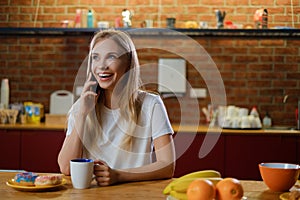 Beautiful young woman having breakfast