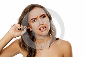 Woman with itchy ear