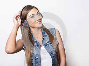 Beautiful young woman with head phones