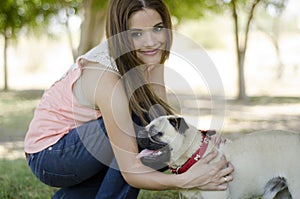 Beautiful young woman and her dog