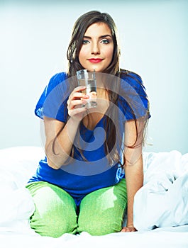 Beautiful young woman hold wated glass