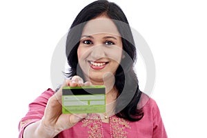 Beautiful young woman holding credit card