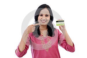 Beautiful young woman holding credit card