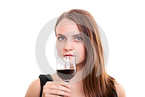 Beautiful young woman holding a glass of wine