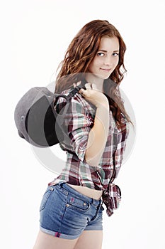 Beautiful young woman holding helmet for showjumping