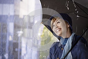 Beautiful young woman holding umbrella