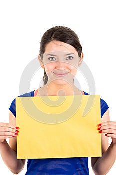 Beautiful young woman holding yellow blank sign