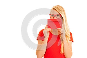 Beautiful young woman holds red envelope - a love letter for va