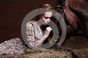 Beautiful young woman with a horse