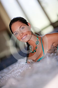 Beautiful young woman at a jacuzzi