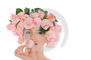 Beautiful young woman with jewelry of roses