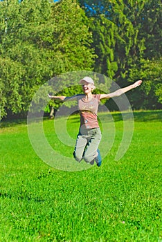 Beautiful young woman jumping