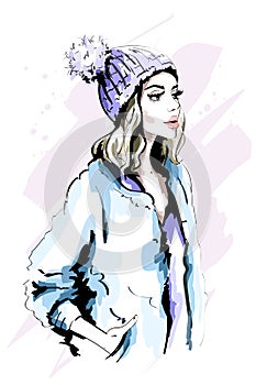 Beautiful young woman in knitted Hat with Fur Pom-Pom. Hand drawn stylish woman portrait. Fashion lady. Winter outfit.