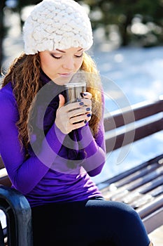 Beautiful young woman in knitted hat and sweater