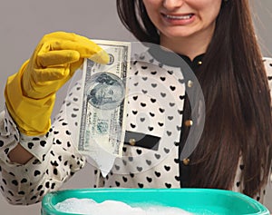 Beautiful young woman launder shady money (illegal cash, dollars