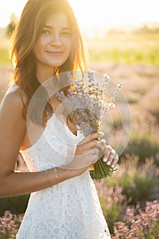 Beautiful Young Woman on Lavender Field Background