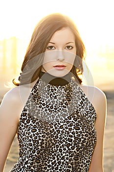 Beautiful young woman in leopard print top