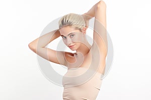 Beautiful Young woman lifting hands up to show off clean and hygienic armpits or underarms on white background, Smooth armpit