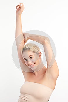 Beautiful Young woman lifting hands up to show off clean and hygienic armpits or underarms on white background, Smooth armpit