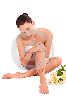 Beautiful young woman with lily flowers