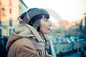 Beautiful young woman listening to music headphones