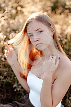 Beautiful young woman looking at the camera