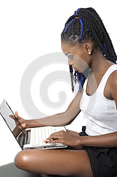 Beautiful young woman looking at laptop screen