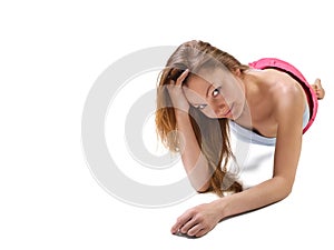 Beautiful young woman lying down the floor