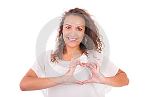 Beautiful young woman making a heart with hands