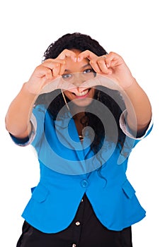 Beautiful young woman making a heart with hands