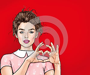 Beautiful young woman making heart with her hands on red background. Positive human emotion expression feeling life body language. photo
