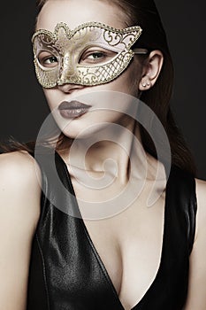 Beautiful young woman in mask