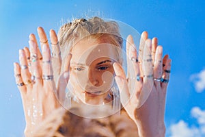 Beautiful young woman model reflection in mirror portrait