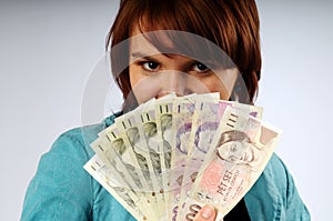 The beautiful young woman with money