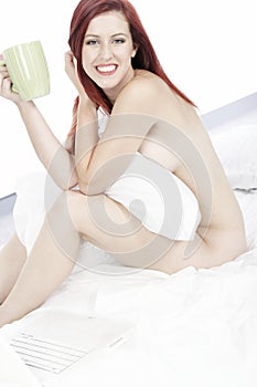 Woman naked on bed