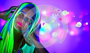 Beautiful young woman in neon light