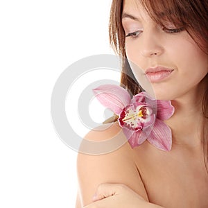 Beautiful young woman with orchid