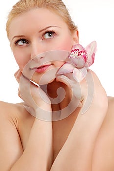 Beautiful young woman with orchid