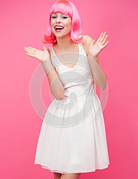 Beautiful young woman over pink background