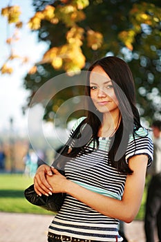 Beautiful young woman in park