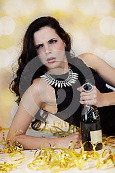 Beautiful young woman partying with champagne