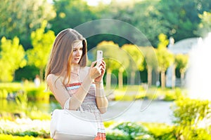 Beautiful young woman photographed on a mobile phone