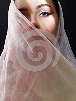 Beautiful young woman in pink hijab. beauty girl in sunlight