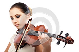 Beautiful young woman playing violin over white