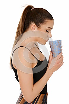 Beautiful young woman with pony tail holding cup