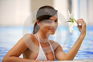 Beautiful young woman at a pool