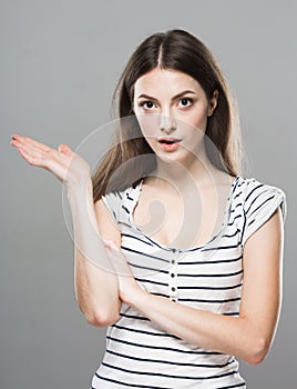 Beautiful young woman portrait cute tender pure smiling posing gray background