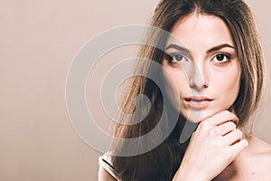 Beautiful young woman portrait cute tender pure smiling touching her chin by fingers attractive nature background